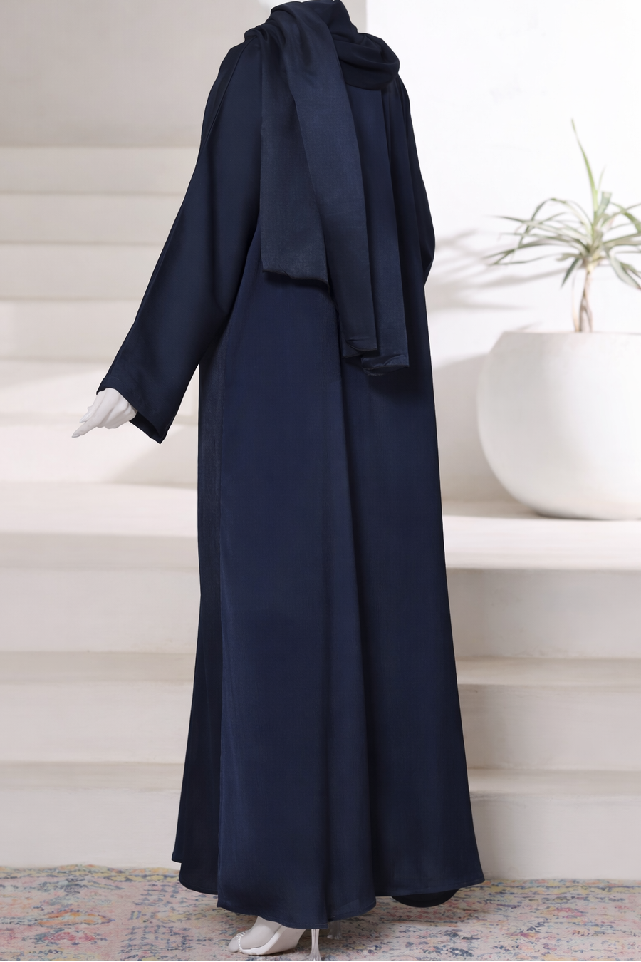 Premium navy abaya gown crafted from imported Romantic Nada fabric, featuring an elegant modest drape with matching dupatta.