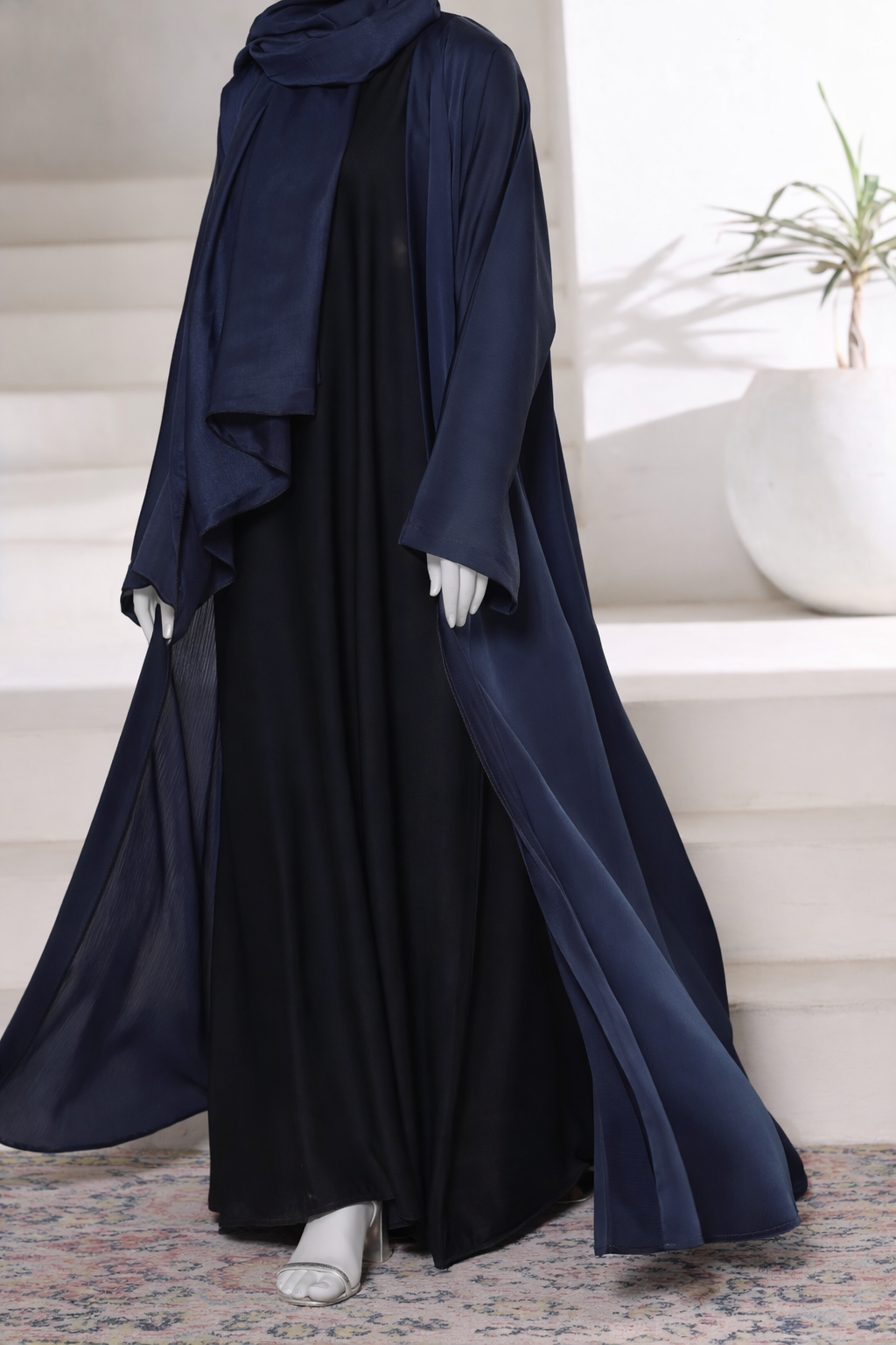 Premium navy abaya gown crafted from imported Romantic Nada fabric, featuring an elegant modest drape with matching dupatta.