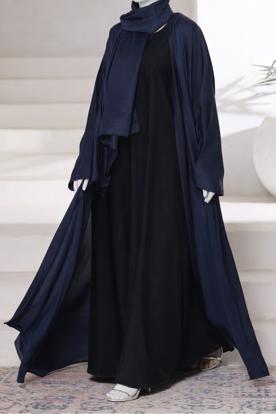 Premium navy abaya gown crafted from imported Romantic Nada fabric, featuring an elegant modest drape with matching dupatta.
